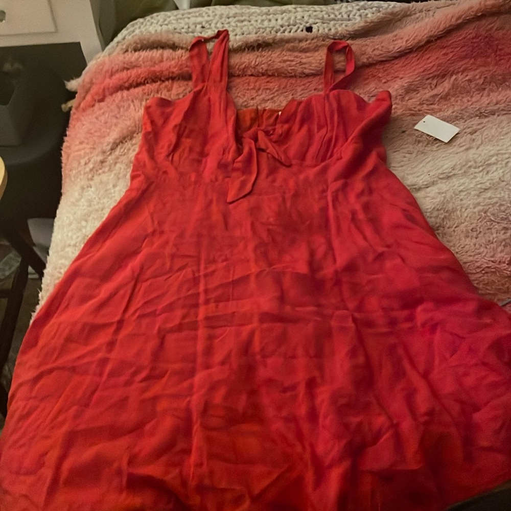 Red dress. Little opening in the front